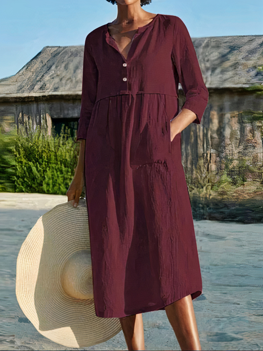 Damen-Midikleid mit langen Ärmeln, luftigem Schnitt und sommerlichem Design – ideal für warme Tage.