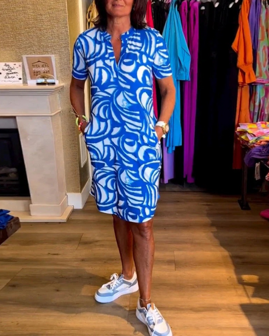 Damen Vintage-Sommerkleid mit schwungvollem Schnitt, ideal für warme Tage und vielseitige Sommeroutfits.

