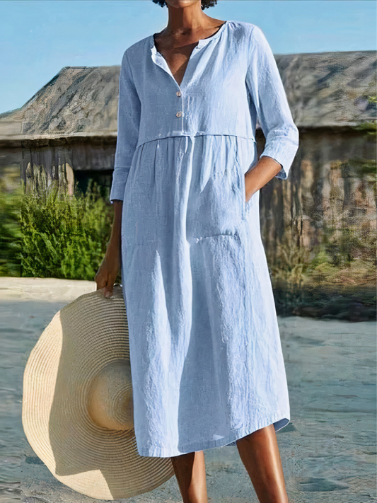 Damen-Midikleid mit langen Ärmeln, luftigem Schnitt und sommerlichem Design – ideal für warme Tage.