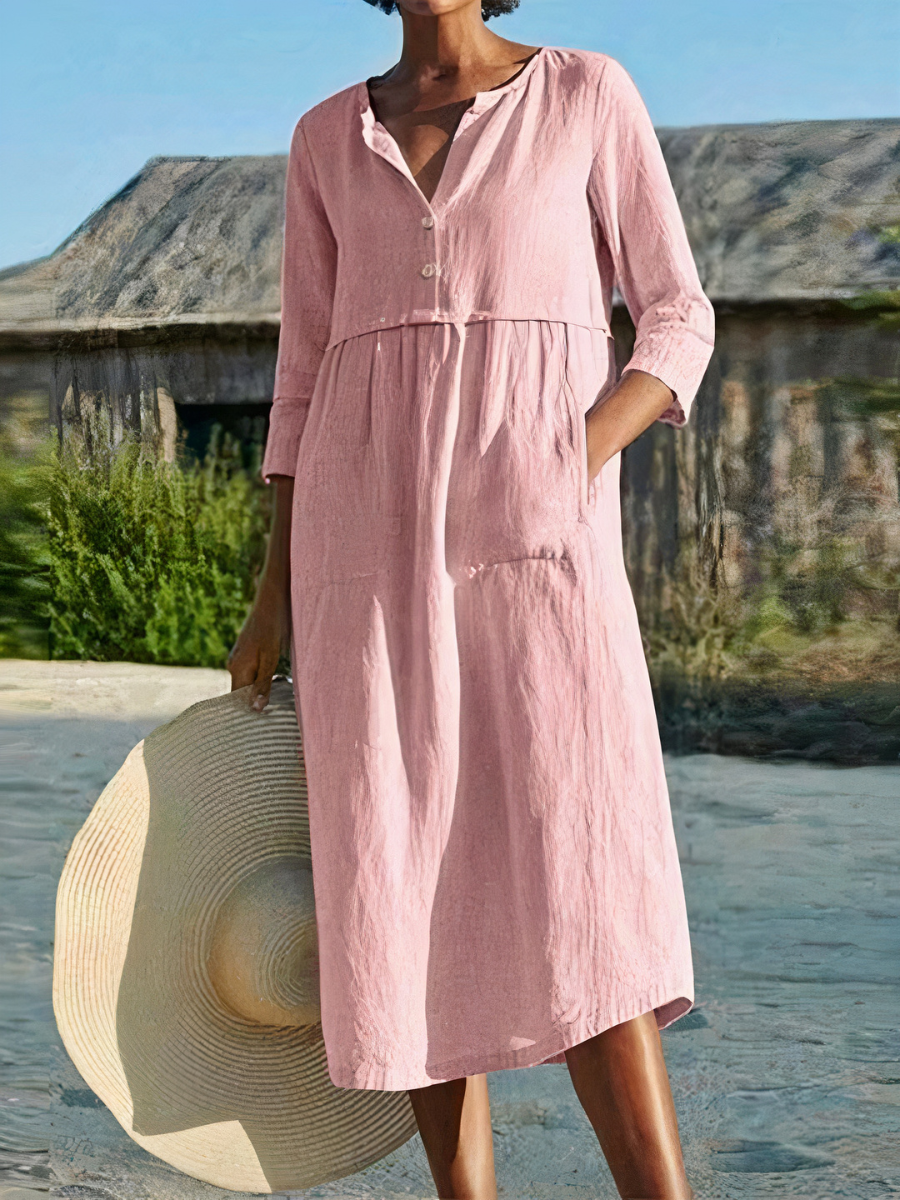 Damen-Midikleid mit langen Ärmeln, luftigem Schnitt und sommerlichem Design – ideal für warme Tage.