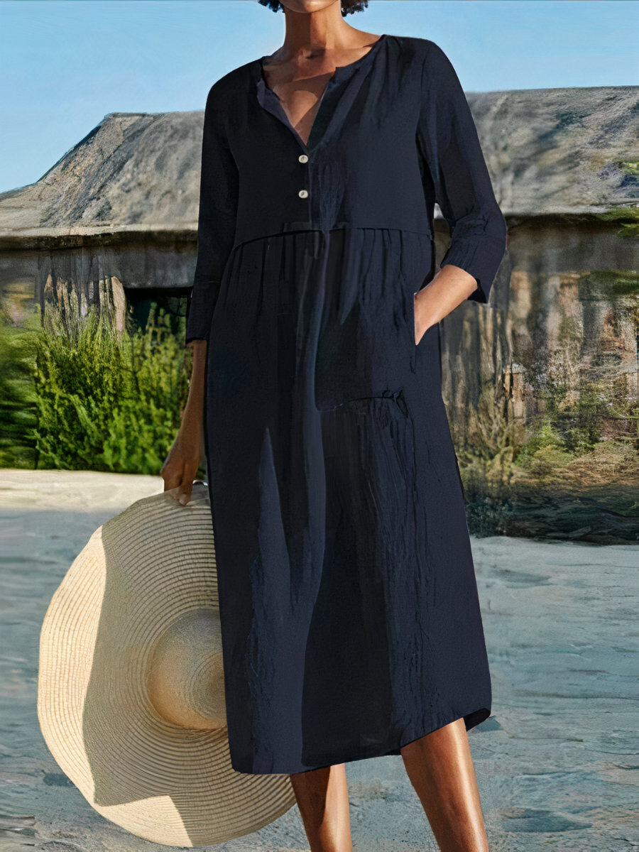 Damen-Midikleid mit langen Ärmeln, luftigem Schnitt und sommerlichem Design – ideal für warme Tage.