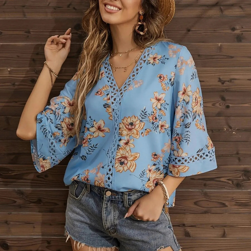  Sommerbluse mit Blumenmuster für Damen in lockerer Passform für warme Tage.