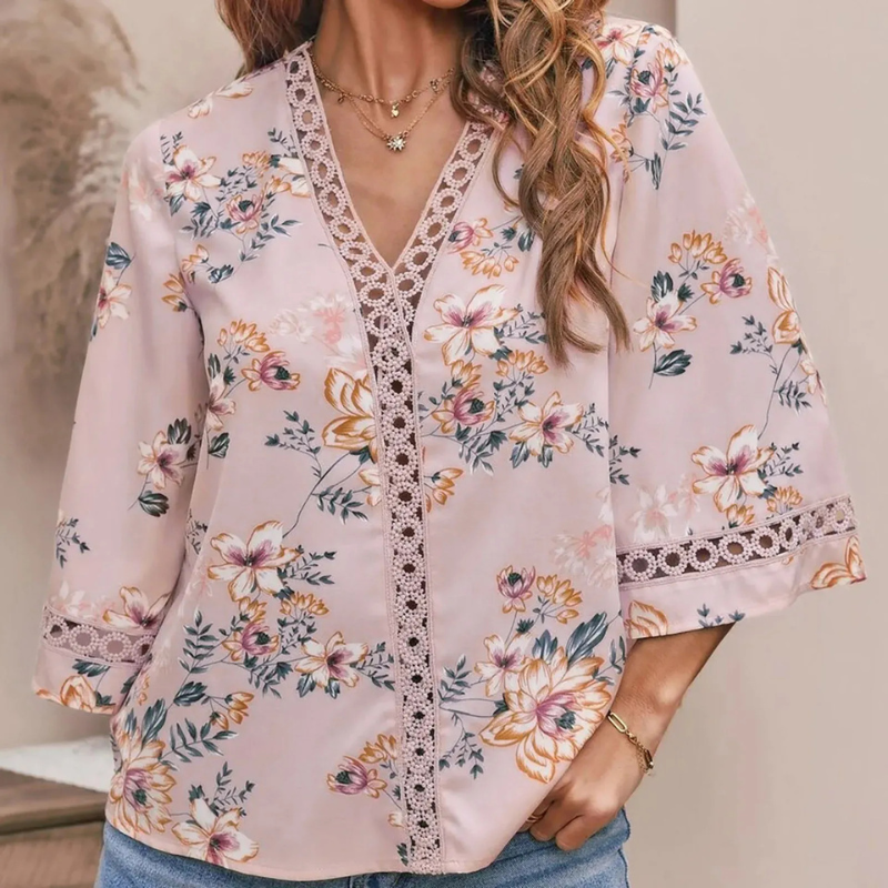  Sommerbluse mit Blumenmuster für Damen in lockerer Passform für warme Tage.